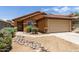 Attractive home with desert landscaping and a convenient attached two-car garage at 25840 W Whyman St, Buckeye, AZ 85326