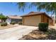 Home featuring desert landscaping and a two-car garage at 25840 W Whyman St, Buckeye, AZ 85326