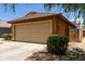 Home with desert landscaping, a 2 car garage, and extra parking on the driveway at 25840 W Whyman St, Buckeye, AZ 85326