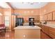 Spacious kitchen featuring ample counter space, cabinets, island, and modern appliances at 25840 W Whyman St, Buckeye, AZ 85326