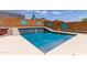 Stunning in-ground pool with unique tile design and expansive patio area at 25840 W Whyman St, Buckeye, AZ 85326