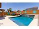 Backyard oasis with in-ground pool, hot tub, and ample patio space for relaxation at 25840 W Whyman St, Buckeye, AZ 85326