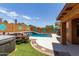 Inviting pool and spa with decorative tiled walls and patio area for outdoor entertaining at 25840 W Whyman St, Buckeye, AZ 85326