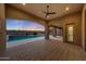 Inviting outdoor living space featuring a pool, covered patio, and stone pavers at 26204 S Washington St, Chandler, AZ 85249