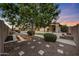 Serene backyard featuring a lush garden, stone walkways, and manicured shrubbery at 26204 S Washington St, Chandler, AZ 85249