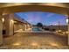 Inviting backyard featuring a swimming pool, manicured landscaping, and brick pavers at 26204 S Washington St, Chandler, AZ 85249