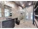 Modern bathroom featuring marble floors, a glass shower, and a black vanity at 26204 S Washington St, Chandler, AZ 85249