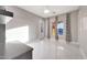 This is a spacious bedroom with tiled floors, nice drapes and a walk-out to the pool area at 26204 S Washington St, Chandler, AZ 85249