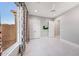 Bedroom with large window, tiled floors, a ceiling fan and TV on the wall at 26204 S Washington St, Chandler, AZ 85249