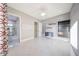 Bright bedroom featuring stylish lighting, tiled floors, built in shelving, and an ensuite bath at 26204 S Washington St, Chandler, AZ 85249