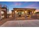 Backyard covered patio with an outdoor kitchen and a spiral staircase to a rooftop deck at 26204 S Washington St, Chandler, AZ 85249