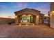 An exterior view of a home showing an open kitchen with stainless steel appliances at 26204 S Washington St, Chandler, AZ 85249