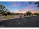 Expansive view of this single story home with mature landscaping, desert landscaping, and circular driveway at 26204 S Washington St, Chandler, AZ 85249