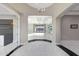 Foyer view into the living room with a trey ceiling and sliding glass doors at 26204 S Washington St, Chandler, AZ 85249