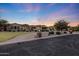 Beautiful home exterior with well-manicured lawn and inviting circular driveway at twilight at 26204 S Washington St, Chandler, AZ 85249
