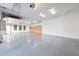 Spacious three-car garage with epoxy floors, built in cabinets, and windows for natural light at 26204 S Washington St, Chandler, AZ 85249