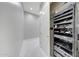 A hallway with a closet that features networking and entertainment equipment at 26204 S Washington St, Chandler, AZ 85249