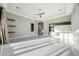 Bright living room featuring marble flooring, recessed lighting, and seamless access to outdoor living spaces at 26204 S Washington St, Chandler, AZ 85249