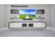 Modern living room features custom shelving, media console, and sleek, contemporary design elements at 26204 S Washington St, Chandler, AZ 85249