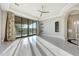 Bright living room with marble floors, recessed lighting, and a large sliding glass door to the outside at 26204 S Washington St, Chandler, AZ 85249