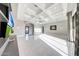 Expansive living area with marble floors, coffered ceilings, and modern entertainment center at 26204 S Washington St, Chandler, AZ 85249