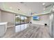 Bright, open living room with tile floors and sliding glass doors offering views of the pool at 26204 S Washington St, Chandler, AZ 85249