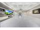 Spacious living room with modern shelving, sleek TV console, and bright marble floors at 26204 S Washington St, Chandler, AZ 85249