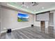 Finished media room featuring a projector, large screen, and modern lighting at 26204 S Washington St, Chandler, AZ 85249