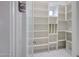 Walk-in pantry with custom shelving providing ample storage space at 26204 S Washington St, Chandler, AZ 85249