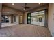 Expansive patio area with tile flooring, leading to the home's interior through sliding glass doors at 26204 S Washington St, Chandler, AZ 85249