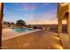 A backyard pool with desert landscaping and an outdoor pergola at 26204 S Washington St, Chandler, AZ 85249