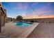 A backyard swimming pool with brick pavers and string lights overhead at 26204 S Washington St, Chandler, AZ 85249