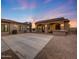Backyard featuring a covered patio with an outdoor bar, a paved patio, and desert landscaping at 26204 S Washington St, Chandler, AZ 85249