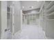 Bright walk-in closet with custom shelving, marble floors, and plenty of room for organization at 26204 S Washington St, Chandler, AZ 85249