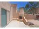 Backyard patio view with built-in fireplace and desert landscaping at 38065 N Cave Creek Rd # 2, Cave Creek, AZ 85331