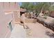 Balcony with fireplace and desert vegetation view at 38065 N Cave Creek Rd # 2, Cave Creek, AZ 85331