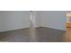 Spacious bedroom features hardwood floors with a door leading to the stairway and a bathroom at 38065 N Cave Creek Rd # 2, Cave Creek, AZ 85331