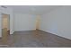 Spacious bedroom features hardwood floors with a door leading to the hallway and recessed lighting at 38065 N Cave Creek Rd # 2, Cave Creek, AZ 85331