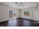 Bright bedroom with hardwood floors, fan, balcony access, and desert views at 38065 N Cave Creek Rd # 2, Cave Creek, AZ 85331