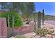 Property entrance showcases desert landscaping, community sign, and neighborhood address at 38065 N Cave Creek Rd # 2, Cave Creek, AZ 85331