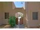 Courtyard featuring a wooden gate, mature landscaping and views of the community at 38065 N Cave Creek Rd # 2, Cave Creek, AZ 85331