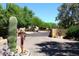 Community gate with desert plants creates an inviting, secluded entrance to the property at 38065 N Cave Creek Rd # 2, Cave Creek, AZ 85331