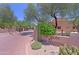 Community entrance to The Villas at Black Mountain with mature trees and desert landscaping at 38065 N Cave Creek Rd # 2, Cave Creek, AZ 85331