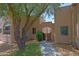 Exterior architecture showcasing private entrance, desert landscaping, and charming walkway at 38065 N Cave Creek Rd # 2, Cave Creek, AZ 85331