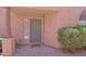 Home's front entrance featuring a tiled address plate, desert landscaping, and a covered patio at 38065 N Cave Creek Rd # 2, Cave Creek, AZ 85331