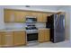 Updated kitchen with stainless steel appliances, and light wood cabinets at 38065 N Cave Creek Rd # 2, Cave Creek, AZ 85331