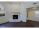 Bright living room featuring a fireplace, hardwood floors, and detailed architectural design at 38065 N Cave Creek Rd # 2, Cave Creek, AZ 85331