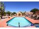 Sparkling pool with lounge chairs, mature landscaping, and a spa, a perfect outdoor retreat at 38065 N Cave Creek Rd # 2, Cave Creek, AZ 85331