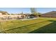 Expansive backyard featuring a luxurious pool and spa, complete with comfortable lounge chairs for relaxing outdoors at 3917 E Patrick Ln, Phoenix, AZ 85050
