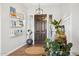 Inviting entryway with dark wood door, light walls, and decorative shelving at 3917 E Patrick Ln, Phoenix, AZ 85050